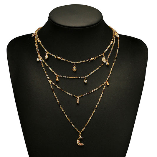 Collana con stella e luna placcata in oro. - Ciondolandia